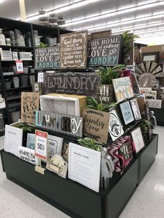 a display in a store filled with lots of greeting cards and other items for sale