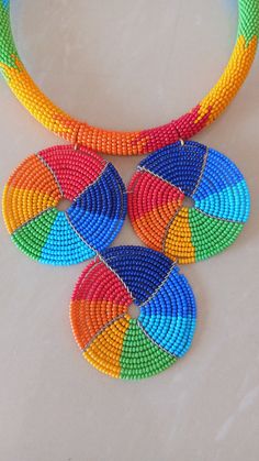 Colorful Beaded Necklace, Rainbow African Beaded Jewelry, African Necklace, Handmade Necklace, Multi color Necklace, Gift For Her, Necklace This colorful beaded necklace is superbly crafted which can be worn with any outfit at different occasions and it will absolutely makes you stand out. Main color - Rainbow. The necklace can be available in plain colors. Wholesale available at a fair price,please contact me. For any clarification,please send me a convo or an e-mail. Thank you for visiting and Multicolor Beaded Necklaces With Round Beads, Multicolor Round Beads Necklace, Multicolor Large Round Beads, Large Multicolor Round Beads, Multicolor Beaded Necklaces For Crafting, Colorful Beaded Necklaces With Large Round Beads, Multicolor Polished Beads For Crafting, Colorful Beaded Necklace With Large Round Beads, Colorful Necklace With Large Round Beads