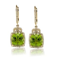 14K Yellow Gold .42ctw Diamond and 4.20ctw Peridot Earrings Matching vivid green cushion cut peridots with a 4.20 carat total weight are beautifully showcased amid the warmth and brilliance of 14K yellow gold prongs. Demi-pavé set halos of shimmering round diamonds surround the sparkling peridots with a stunning and scintillating brilliance. A single diamond is bezel set at the crest of each peridot with diamonds set in a detailed motif accenting the haloed peridots. Designed to gently and radia Earrings Matching, Peridot Earrings, Green Cushions, Cushion Cut, Bezel Setting, Round Diamonds, Timeless Elegance, Halo, Dangle Drop Earrings