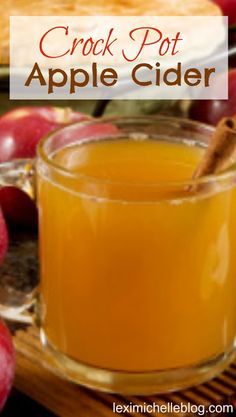 crock pot apple cider in a glass mug with cinnamon stick