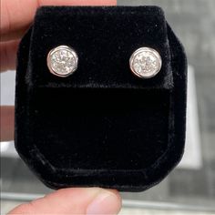 10k White Gold Post 2 Carat Diamond Moissanite Bezel Set Stud Earrings. 6.5 Mm Each Stud (1 Ct Each) New!! Retail Price: $399 Color: D/E Clarity: Vvs1 These Stunning 2 Carat Diamond Moissanite Studs Have A Solid 10k White Gold Posts & 925 Sterling Silver Bezel Setting And Butterfly Backs. Matching Necklace For Sale In Separate Listing!! 1 Carat (Each) Earring & Are D/E Color And Vvs1 Clarity. Tons Of Sparkle, Fire, And Brilliance!! Each Stone Measures 6.5mm And Weighs 1 Carat. Stunning Quality!! Fine Jewelry Diamond White Diamond Earrings With Bezel Setting, Diamond White Diamond Earrings With Bezel Setting, White Gold Cubic Zirconia Diamond Earrings With Bezel Setting, Diamond White Bezel Set Earrings For Anniversary, Diamond Earrings With Bezel Setting, Round Cut, Classic Bezel-set Round Cut Diamond Earrings, Formal Vvs Clarity Diamond Earrings In 14k White Gold, Timeless White Gold Diamond Earrings With Bezel Setting, Classic Round Cut Diamond Earrings With Bezel Setting