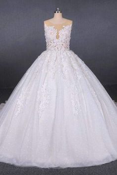 a white wedding dress on a mannequin