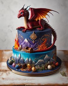 a three tiered cake with a dragon on top