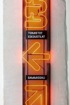 a neon sign on the side of a building that says san francisco, tomis - tot kocostilat, sammosali