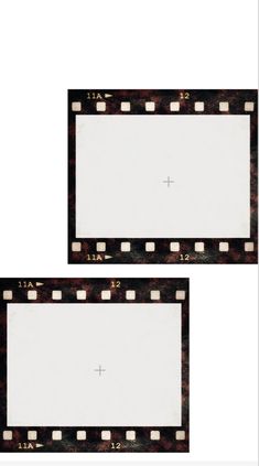 two old film frames with white paper on them