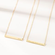 The Skinny Bar Necklace is both classic and modern. It looks great with a t-shirt or a cocktail dress. Personalize this piece with kids names, wedding dates, birthdays - the possibilities are endless, and did we mention it's reversible?! available in 14k yellow, 14k rose and 14k white gold skinny bar is 1.5″ L x 3/16″ W and is reversible back text lowercase font and center aligned only (25 characters max) to enter symbols, copy & paste from here:  +  &   /  –  .  #  °  hangs on a cable chain available in adjustable lengths of 14"-16" or 16-18".  View our necklace size guide here. Made in the USA Wedding Dates, Tiny Tags, Wedding Song, Gold Bar Necklace, Kids Names, Rose Gold Chain, Necklace Size, Copy Paste, Yellow Gold Chain