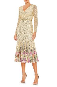 Twinkling beads and sequins bring showstopping sparkle to a long-sleeve mesh cocktail dress romanced by shimmering flowers along a flounced hem. 48 1/2" length Hidden back-zip closure V-neck Long sleeves Lined, except sleeves 100% polyester Spot clean Imported Asian Owned/Founded Long Sleeve Sequin Dress For Spring Gala, Spring Event Dresses With Long Sleeves, Elegant Long Sleeve Sequin Dress For Spring, Spring Event Long Sleeve Dress, Spring Long Sleeve Embellished Sequin Dress, Spring Embellished Dress For Events, Spring Embellished Event Dress, Spring Event Embellished Dresses, Mesh Cocktail Dress