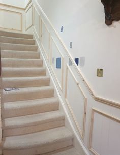 the stairs are painted white with blue chippings on them and there is no carpet