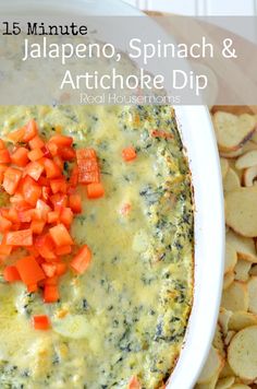 a white bowl filled with spinach and artichoke dip next to sliced potatoes