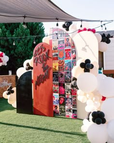 an outdoor party with balloons and decorations