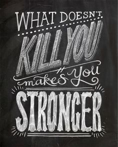 a chalkboard with the words what doesn't kill you makes you stronger