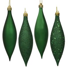 three green christmas ornaments hanging from the ceiling