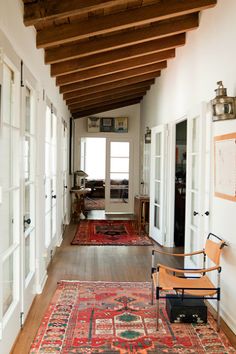 the hallway is clean and ready for guests to use it as an entrance way or sitting area