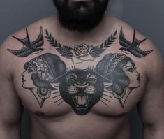 a man with tattoos on his chest has an angry cat and two birds above him