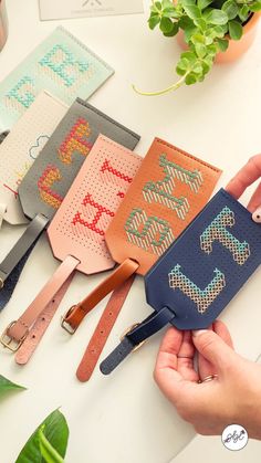 DIY Cross Stitch Leather Luggage Tag Kit Embroidery Luggage Tags, Travel Luggage Tags Ideas, Cross Stitch Luggage Tag, Travel Tags Luggage Diy, Cross Stitch Accessories Products, Luggage Tag Diy, Diy Luggage Tag, Diy Luggage Tags, Embroidered Luggage Tags