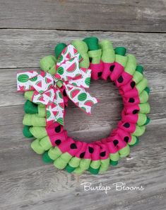 a watermelon wreath with a bow on it