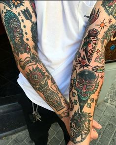 a man with many tattoos on his arms