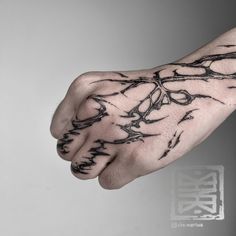 a person's hand with black ink on it