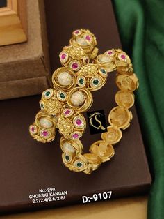 Description :- Bangles Gold Plated Fully Openable Kada Kangan Bangles | Gold Kada Bangles | Gold Patla | Wedding Indian Temple Jewlery | punjabi jewelry Gift yourself a royal look with this perfectly crafted necklace set from Manalisstudio. Crafted with high quality stones and pearls, it is impressive in design. The green enamel artwork adds perfect texture to the design. Perfect for weddings and festivities, this antique Chuda set should be put on with your favorite sari or lehenga. 100% Satisf Traditional Stone Work Bangle For Reception, Temple Jewelry Bangle For Festivals And Receptions, Temple Jewelry Bangle For Reception And Festivals, Temple Jewelry Bangle For Receptions And Festivals, Traditional Meenakari Bracelets For Reception, Temple Jewelry Bangle With Stone Work For Reception, Traditional Bangle With Stone Work For Marriage, Traditional Gold Bangle For Reception, Meenakari Bangle For Reception