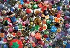 many different colored buttons are arranged in the shape of a christmas or new year's decoration