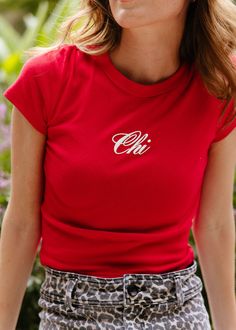 **Alice & Wonder original design** Rep your fav city in this seasons biggest color - Cherry Red.Micro blend rib baby tee with "Chi" puff printed on front.Alice & Wonder logo printed small at back of neck. Model is wearing a size S.