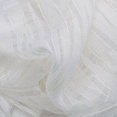 an image of white fabric with lines on the bottom and sides, as if it were made from silk or tulle