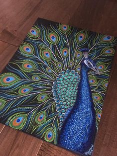 a painting of a peacock with blue feathers