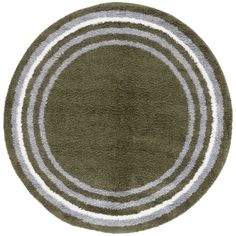 a round rug with white and green stripes on it, in the middle of an oval shape