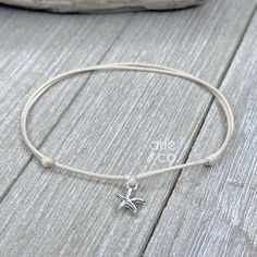 Handmade Waterproof Cord Anklet Bracelet with Silver Plated Starfish Charm, Waterproof Anklet, Surfer Anklet Bracelet, Adjustable Anklet Elevate your style with our handmade waterproof cord anklet or bracelet, featuring a beautiful silver-plated starfish charm. This simple yet elegant piece is perfect for any occasion--whether you're at the beach, on vacation, or just enjoying a casual day out. Crafted with durable waterproof cord, it's designed to withstand swimming, showers, and workouts. The Handmade Adjustable Starfish Anklet, Adjustable White Starfish Anklets, White Starfish Anklets For Gift, White Starfish Anklets As Gift, Cord Anklet, Sliding Knot Closure, Minimalist Accessories, Anklet Bracelet, Bracelet Collection