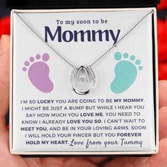 a person holding a necklace in their hand that says to my son to be mommy i'm so lucky you are going to be my mommy