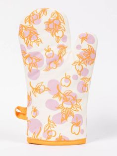 an oven mitt with orange and pink fruit print on the front, sitting upright