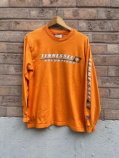 Vintage Tennessee Volunteers NCAA Tshirt private stock tag Size M 19.5 pit to pit 26 length good condition   Be aware that these are used clothes and may have some blemishes, I have tried to disclose them as best as I can, please look at the pictures carefully! Reminder I am not responsible for packages lost in mail carrier as that is out of my control!  All Sales Are Final  Thanks for looking on 705Vintage Etsy page! For more follow our Instagram page- @705Vintage Tennessee Vols Tshirt, Tennessee Vols Shirts, Vintage University Of Tennessee, Vintage Tennessee Vols Shirt, Tennessee Vols Hoodie, Europe Outfits, Tennessee Volunteers, Ncaa, Tennessee