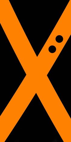 an orange and black traffic sign with the letter x on it's diagonal stripe