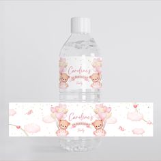 a bottle of water with pink balloons on it and a label that says congratulations for a baby