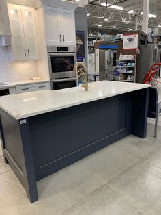 a large kitchen island in the middle of a store