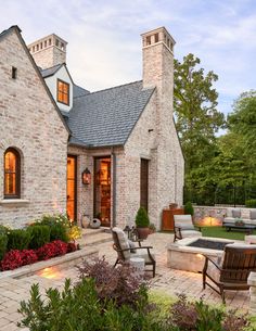 an outdoor patio with seating and fire pit