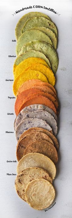 an assortment of different colored tortillas laid out on top of each other