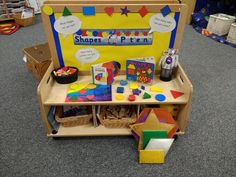 a child's play area with toys and books