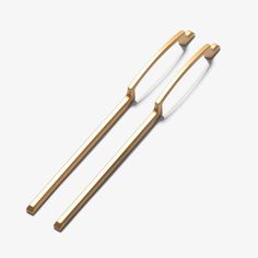 two gold - plated metal hair clips on a white background, one is facing the opposite direction