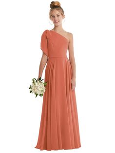 a woman in a long pink bridesmaid dress with one shoulder and pleaed skirt