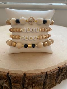 Our Boho Glam stack! These are super stylish, comfortable and perfect for daily wear! Such a chic boho-look! Black onyx and neutral wood make a beautiful contrast! (These are meant to fit snug. If you would like them to feel loose and move around on your wrist, please size up). Each bracelet is carefully handmade with high quality materials: -6mm genuine black onyx (matte) stones -6mm / 8mm / 10mm natural wood beads -5mm brushed gold cylinder spacer -3mm gold hematite beads -3mm gold faceted spa Beaded Bracelets Black, Gold Beads Bracelet, Boho Bracelets Stack, Name Bracelets, Bracelets Black, Wood Bead Bracelet, Sister Jewelry, Word Bracelet, Acrylic Letters