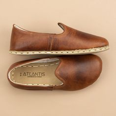 Brown Closed Toe Slip-ons With Stitched Sole, Comfortable Leather Shoes With Stitched Sole And Almond Toe, Comfortable Almond Toe Leather Shoes With Stitched Sole, Classic Slippers With Leather Sole And Round Toe, Swift Leather Shoes With Textured Sole, Closed Toe, Comfortable Leather Shoes With Textured Sole And Almond Toe, Comfortable Leather Shoes With Almond Toe And Leather Footbed, Comfortable Leather Shoes With Almond Toe And Rubber Sole, Comfortable Leather Shoes With Textured Sole And Closed Toe