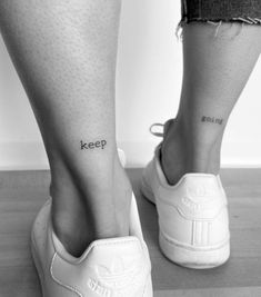 a woman's legs with the word keep written on her lower leg and foot