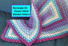 a crocheted blanket that is laying on top of a blue sheet with text reading rectangle 3d cluster blanket pattern