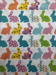 the fabric is colorfully colored and has rabbits on it