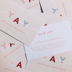 several folded thank you cards on top of each other