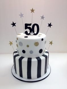 a white and black cake with stars on top