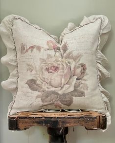 a pillow on top of a wooden shelf