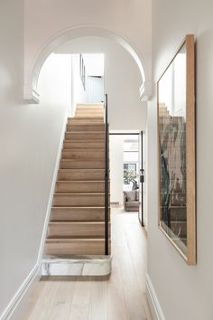 a staircase leading up to a living room