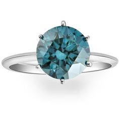 a blue diamond ring on a white background